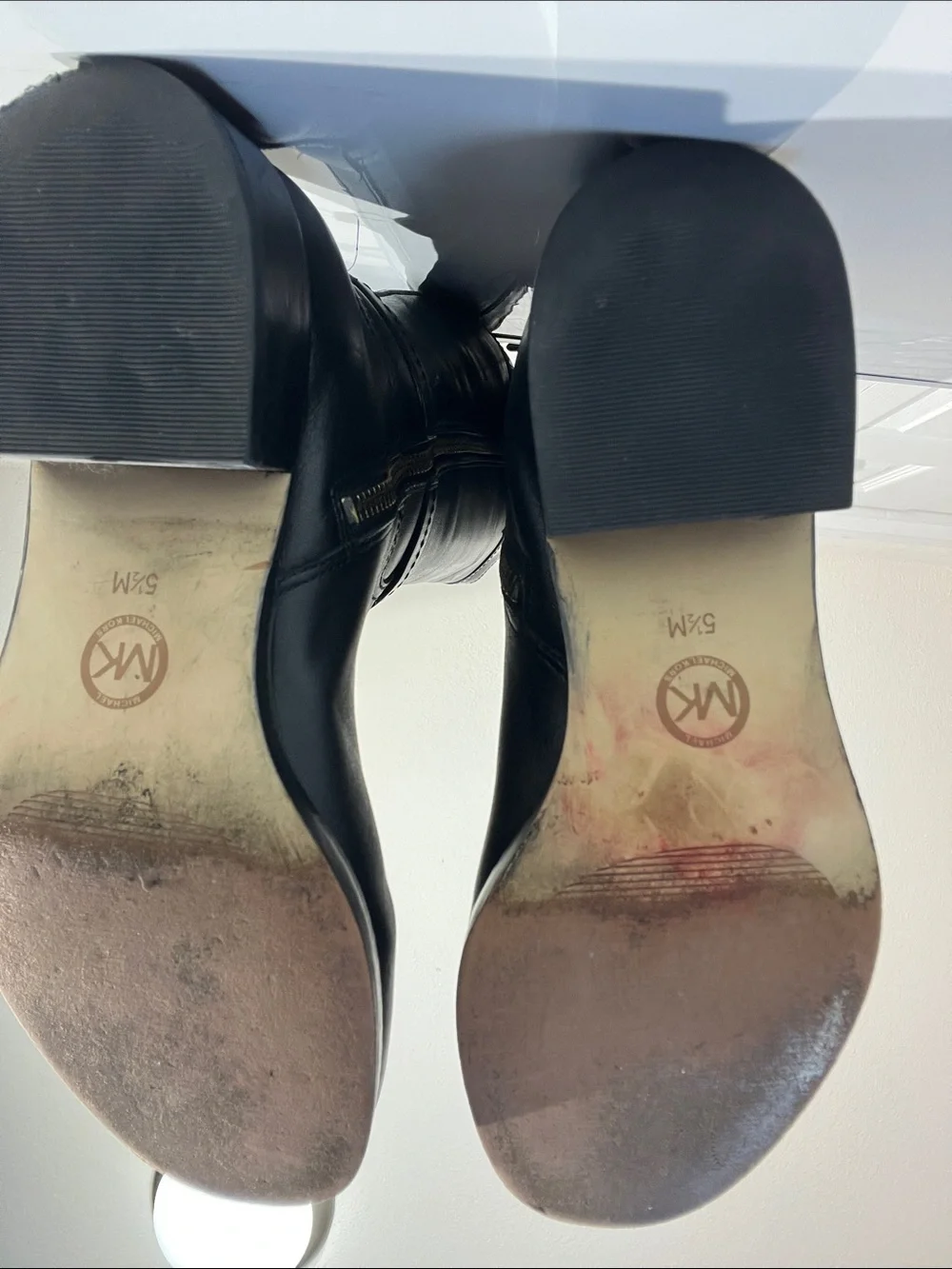 Knee-high leather boots with MK logo